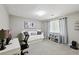 This bedroom has a large window, daybed, and desk, making it the perfect space for relaxation and productivity at 4733 Eidson Road, Dunwoody, GA 30360