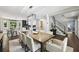 Spacious dining area open to the kitchen, featuring a large table and stylish lighting at 4733 Eidson Road, Dunwoody, GA 30360