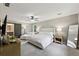 Large main bedroom with sliding barn door to the bathroom, plush carpeting and lots of natural light at 4733 Eidson Road, Dunwoody, GA 30360