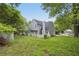 A lush backyard featuring a well-maintained lawn, white picket fence and a two-story house at 484 Culberson Sw St, Atlanta, GA 30310