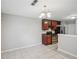 Open dining area featuring an elegant chandelier and access to the kitchen at 484 Culberson Sw St, Atlanta, GA 30310