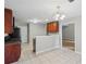 Bright kitchen area with tiled flooring, a functional layout, and easy access to other living spaces at 484 Culberson Sw St, Atlanta, GA 30310