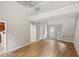 Open-concept living area with sleek flooring, abundant natural light, and a staircase to the second level at 484 Culberson Sw St, Atlanta, GA 30310