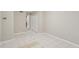 A room with white-tiled floor and access to other rooms through white doors at 484 Culberson Sw St, Atlanta, GA 30310