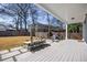 Large backyard with a spacious deck, dining area and privacy fence at 513 Saint Charles Ne Ave, Atlanta, GA 30308