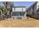Back of house showing a spacious deck, outdoor dining area and private yard at 513 Saint Charles Ne Ave, Atlanta, GA 30308