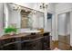 Stylish bathroom showcasing a vessel sink, vintage vanity, chandelier and large shower at 513 Saint Charles Ne Ave, Atlanta, GA 30308