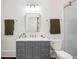 Bathroom featuring a marble countertop, modern grey vanity, and walk-in shower with glass door at 513 Saint Charles Ne Ave, Atlanta, GA 30308