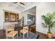 Spacious dining room with built-in cabinets and seamless flow to the modern kitchen at 513 Saint Charles Ne Ave, Atlanta, GA 30308