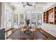 Open dining room featuring a large window, modern lighting, and hardwood flooring at 513 Saint Charles Ne Ave, Atlanta, GA 30308