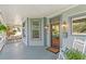 Charming front porch features a rocking chair, ample seating, and a cozy atmosphere at 513 Saint Charles Ne Ave, Atlanta, GA 30308
