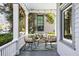 Cozy front porch with comfortable seating, an outdoor rug, and shaded ambiance at 513 Saint Charles Ne Ave, Atlanta, GA 30308