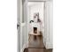 Hallway view leading to a cozy room with a fireplace and white mantel at 513 Saint Charles Ne Ave, Atlanta, GA 30308