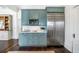 Charming kitchen featuring blue cabinets, stainless steel appliances, and a large stainless steel refrigerator at 513 Saint Charles Ne Ave, Atlanta, GA 30308