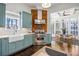 Charming kitchen with blue cabinets, stainless steel appliances, a brick backsplash, and a breakfast nook at 513 Saint Charles Ne Ave, Atlanta, GA 30308