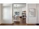 Spacious living room showcasing a cozy fireplace, hardwood floors, and elegant doorway to an adjacent room at 513 Saint Charles Ne Ave, Atlanta, GA 30308