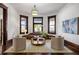 Bright living room with hardwood floors, stylish seating, and large windows providing natural light at 513 Saint Charles Ne Ave, Atlanta, GA 30308
