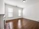 Bright room with hardwood floors, fireplace, and large windows offering natural light at 513 Saint Charles Ne Ave, Atlanta, GA 30308