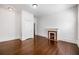 Empty room featuring a fireplace, hardwood floors, white walls and a closet at 513 Saint Charles Ne Ave, Atlanta, GA 30308