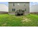 Exterior rear view of home featuring siding, back deck, a lawn and a wooden fence at 105 Arbor Creek Trl, Dallas, GA 30157