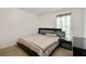 Bedroom featuring a modern bed set with dark wood furniture and neutral colored carpet at 105 Arbor Creek Trl, Dallas, GA 30157