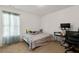 Bedroom featuring a large window and neutral carpet, with a desk and office chair at 105 Arbor Creek Trl, Dallas, GA 30157