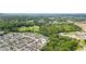 Aerial view of a neighborhood with well-maintained homes and lush green trees at 3698 Roseman Lndg, Cumming, GA 30040