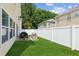 Spacious backyard featuring a patio, grill, and a white privacy fence at 3698 Roseman Lndg, Cumming, GA 30040