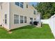 Well-maintained backyard with green lawn, privacy fence, and a patio area at 3698 Roseman Lndg, Cumming, GA 30040
