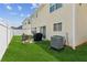 Level backyard featuring lawn, patio, privacy fence, and air conditioning unit at 3698 Roseman Lndg, Cumming, GA 30040