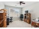 Versatile bedroom with neutral carpet, ceiling fan, window, and suitable for home office setup at 3698 Roseman Lndg, Cumming, GA 30040