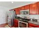 Kitchen featuring stainless steel appliances and ample cabinet space at 3698 Roseman Lndg, Cumming, GA 30040