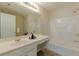 Elegant bathroom with dual sinks, a large mirror, and a separate shower and soaking tub at 768 Nehemiah Sw Ln, Atlanta, GA 30331