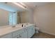 Well-lit bathroom equipped with dual sinks, a large mirror, and ample counter space for toiletries at 768 Nehemiah Sw Ln, Atlanta, GA 30331