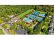 Aerial view of community amenities including pool, tennis courts, and clubhouse at 942 Idlewood Dr, Canton, GA 30115