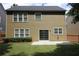 Exterior back view shows the lawn and the windows at 942 Idlewood Dr, Canton, GA 30115