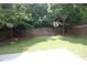 The backyard features a lawn and trees at 942 Idlewood Dr, Canton, GA 30115