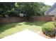 The backyard has a lawn and a tree-lined perimeter at 942 Idlewood Dr, Canton, GA 30115