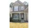 Inviting home exterior featuring manicured landscaping and a covered front porch at 942 Idlewood Dr, Canton, GA 30115