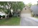 Charming two-story home with well-manicured lawn and inviting curb appeal and a two car garage at 942 Idlewood Dr, Canton, GA 30115
