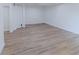 Unfinished basement area with neutral-toned vinyl flooring is ready for renovation or storage at 159 Aztec Se Way, Acworth, GA 30102