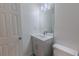 This charming bathroom has an undermount sink with a gray vanity and a modern light fixture at 159 Aztec Se Way, Acworth, GA 30102