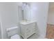 Bathroom offers a vanity sink with marble top, ample storage, a toilet, and a lighted mirror at 159 Aztec Se Way, Acworth, GA 30102