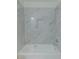 This remodeled bathroom has shower with modern tile and a built-in shelf for toiletries at 159 Aztec Se Way, Acworth, GA 30102