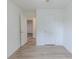 A bright bedroom featuring durable hardwood floors, neutral paint, and closet at 159 Aztec Se Way, Acworth, GA 30102