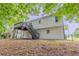 View of the rear exterior showing the elevated deck and fenced yard at 159 Aztec Se Way, Acworth, GA 30102