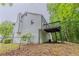 Exterior rear view showing the home's elevated deck and fenced yard at 159 Aztec Se Way, Acworth, GA 30102