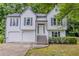 Charming two-story home featuring white siding, black shutters and trim, and a well-maintained front yard at 159 Aztec Se Way, Acworth, GA 30102