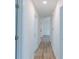 Bright hallway featuring durable hardwood floors and neutral paint scheme at 159 Aztec Se Way, Acworth, GA 30102
