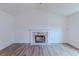 Spacious living room with hardwood floors, vaulted ceiling, and a decorative stone fireplace, perfect for entertaining at 159 Aztec Se Way, Acworth, GA 30102